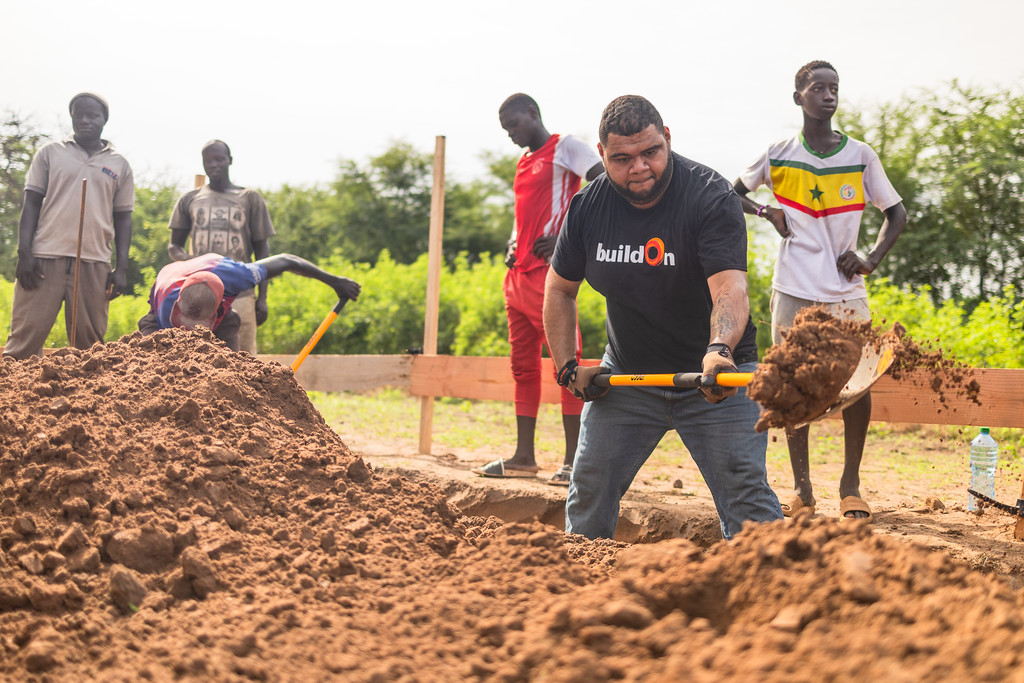 At the worksite, Trek participants work side-by-side with community members.