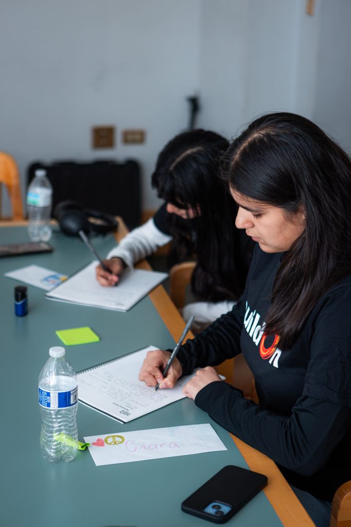 Ciara takes notes during her Pre-Trek meeting with U.S. Trek Specialist Erving Jimenez.
