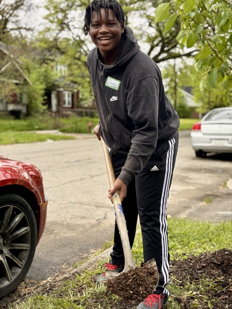 Quincy at service in his Detroit community.