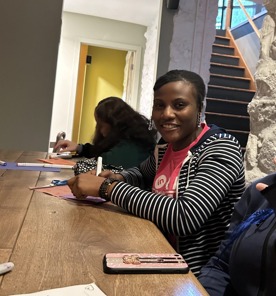 Josephine at service writing letters to seniors in her community.