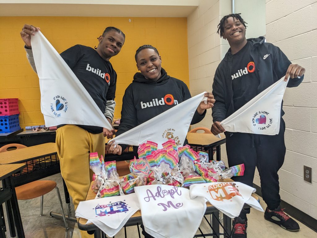 Quincy and his buildOn peers volunteer at a local animal shelter.