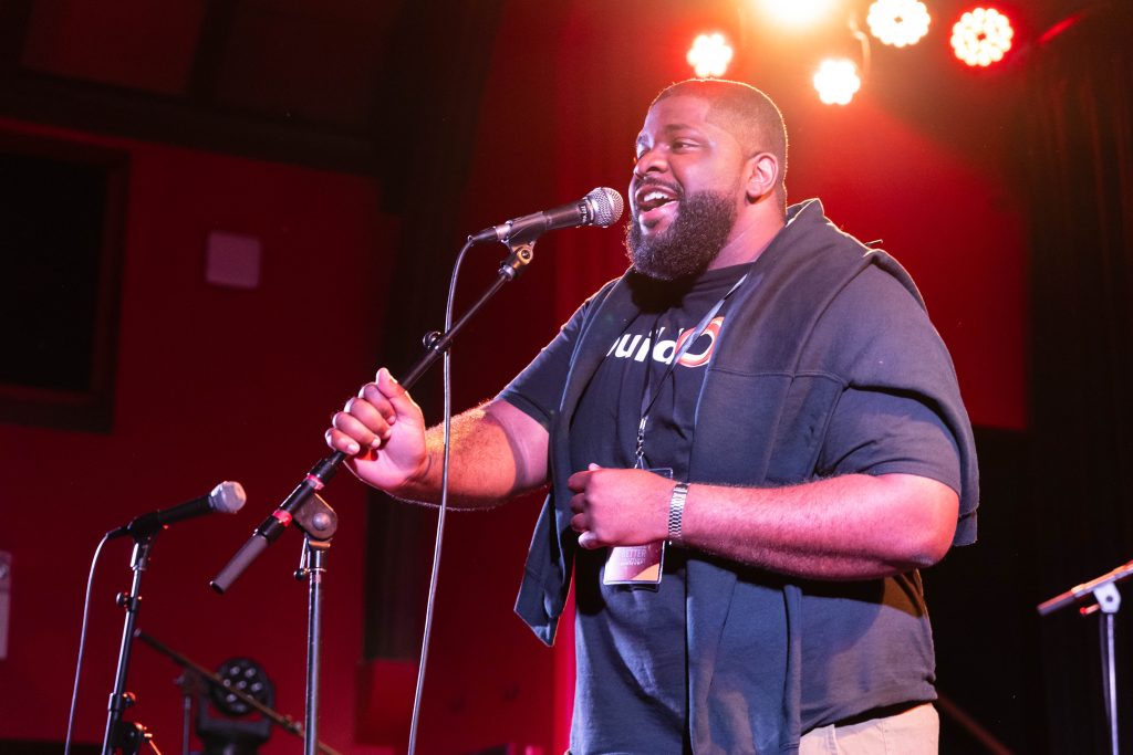 Travis celebrating buildOn Oakland students at the 2024 Better Together concert.