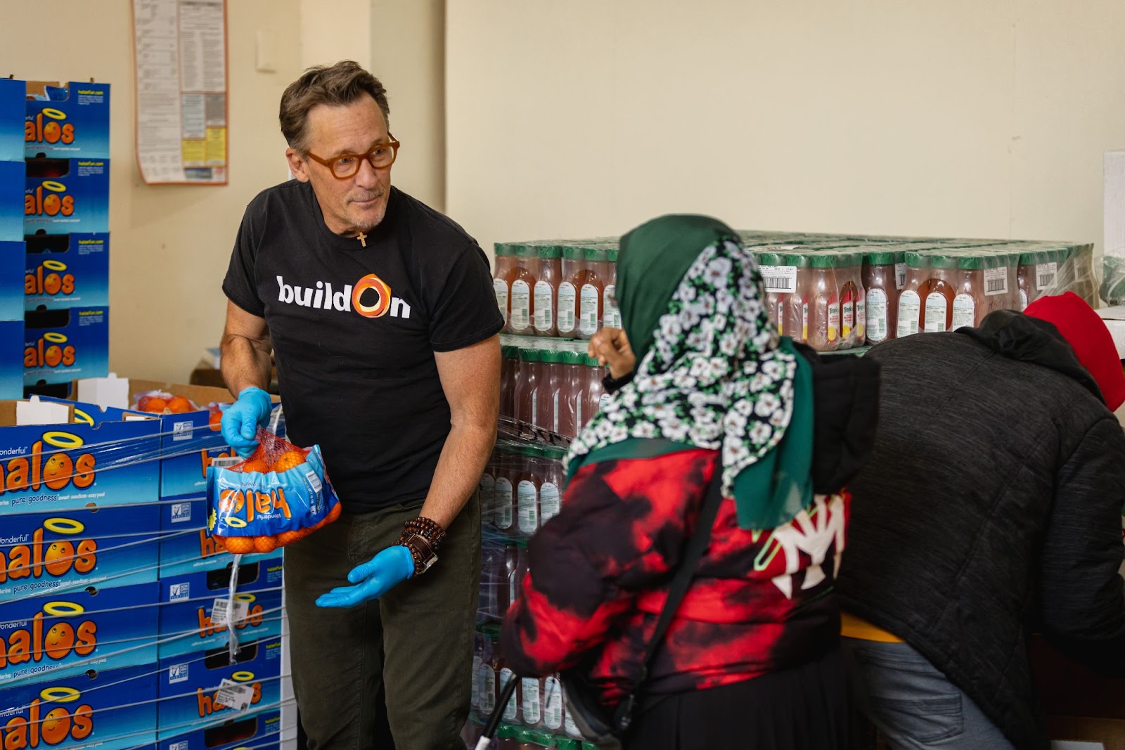 Jim, alongside buildOn students and alumni, helped give out food to recently-arrived immigrants in the South Bronx.
