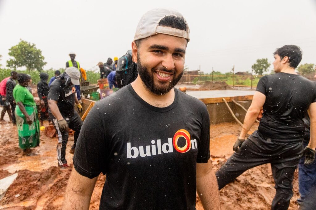 Mohamad, alongside the rest of the Trek group, worked for three and a half more hours in the pouring rain to finish mixing concrete for the school.