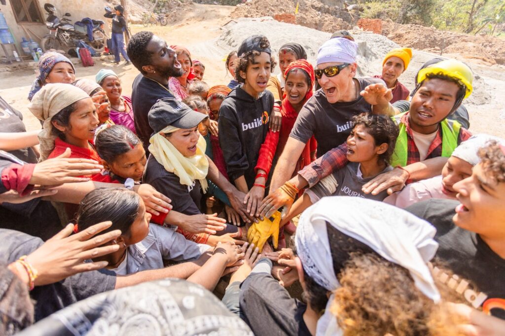 buildOn students join hands to prepare for a day on the worksite. On Trek, students don’t just gain memories—they also build global connections.