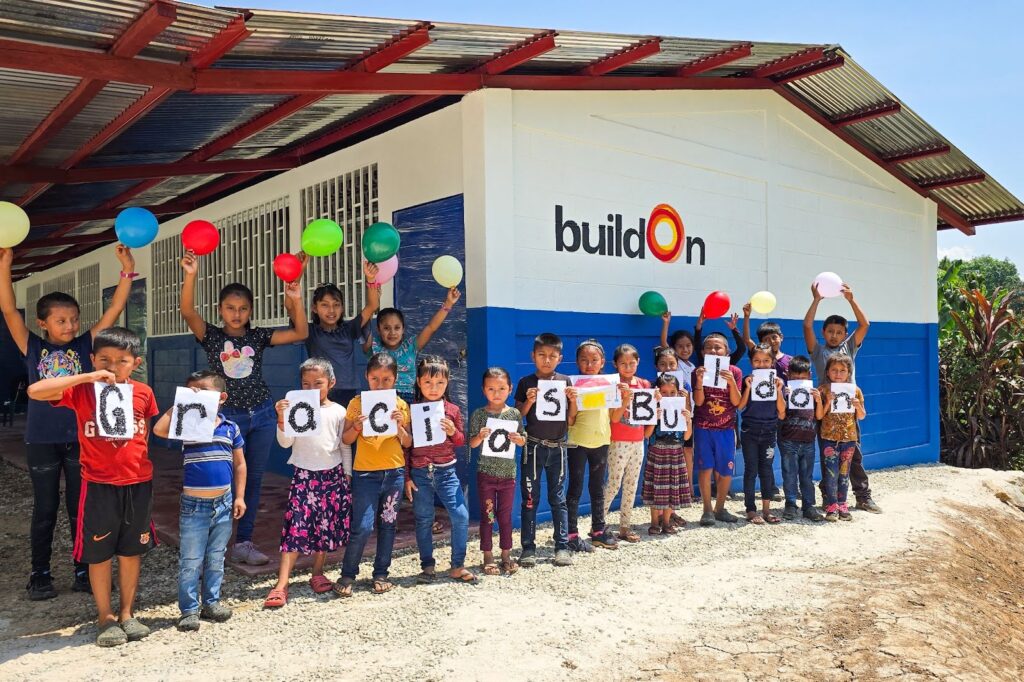The children of Paraje Betania stand outside their brand new school.