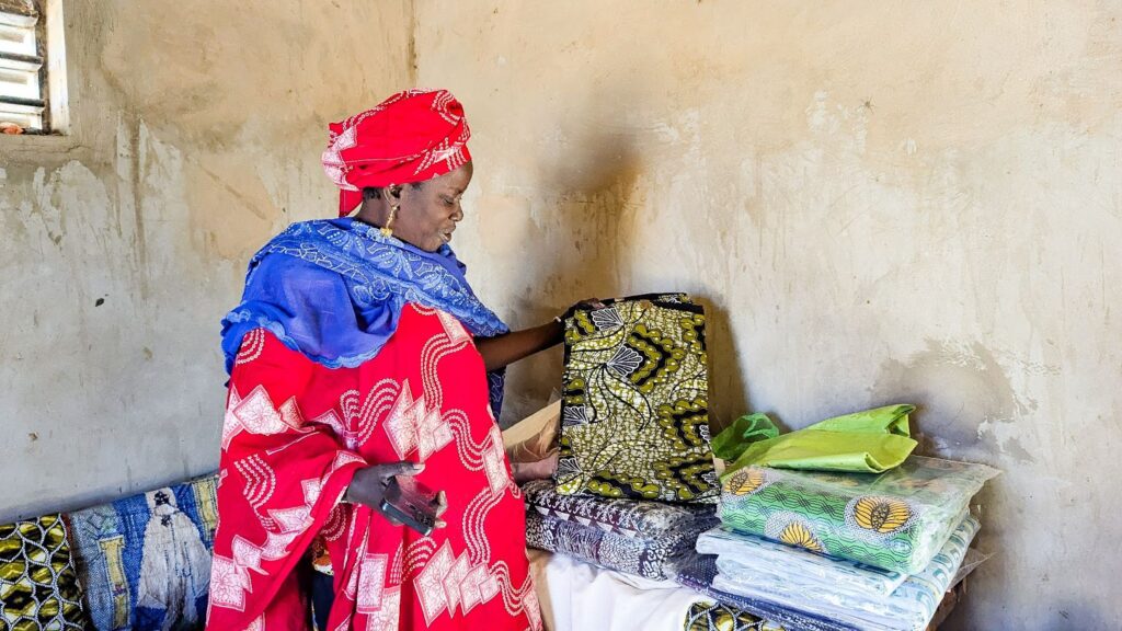 Thanks to seed capital from buildOn, Awa was able to expand her business selling fabrics and toiletries.