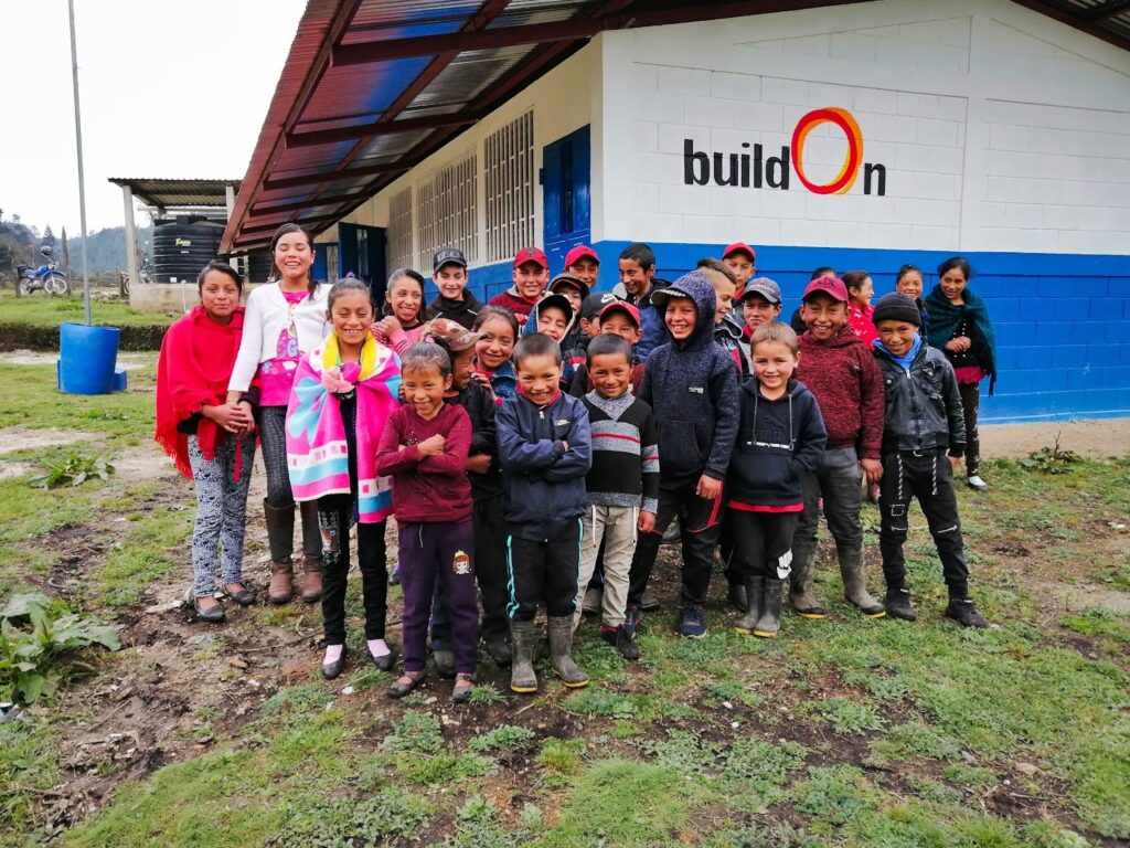 Students in La Magdalena celebrate in front of their brand new buildOn school.