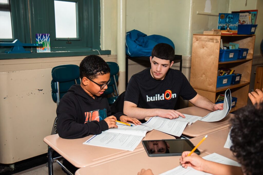 Tutoring younger kids is a mainstay for buildOn students, like this service project in the Bronx.