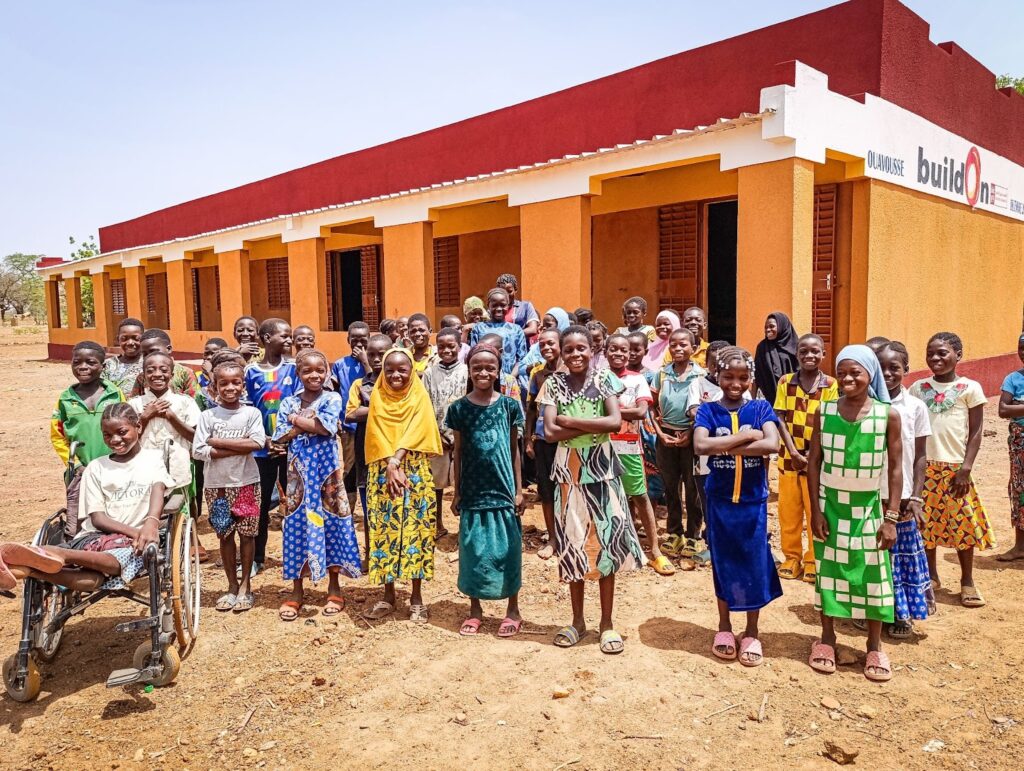 Emilienne and her classmates have a brand new accessible school building in their village.