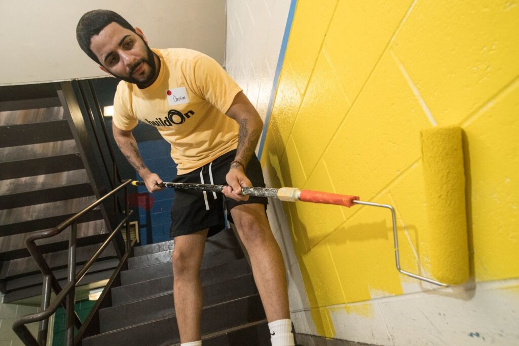 buildOn students in Boston help beautify CASH High School.