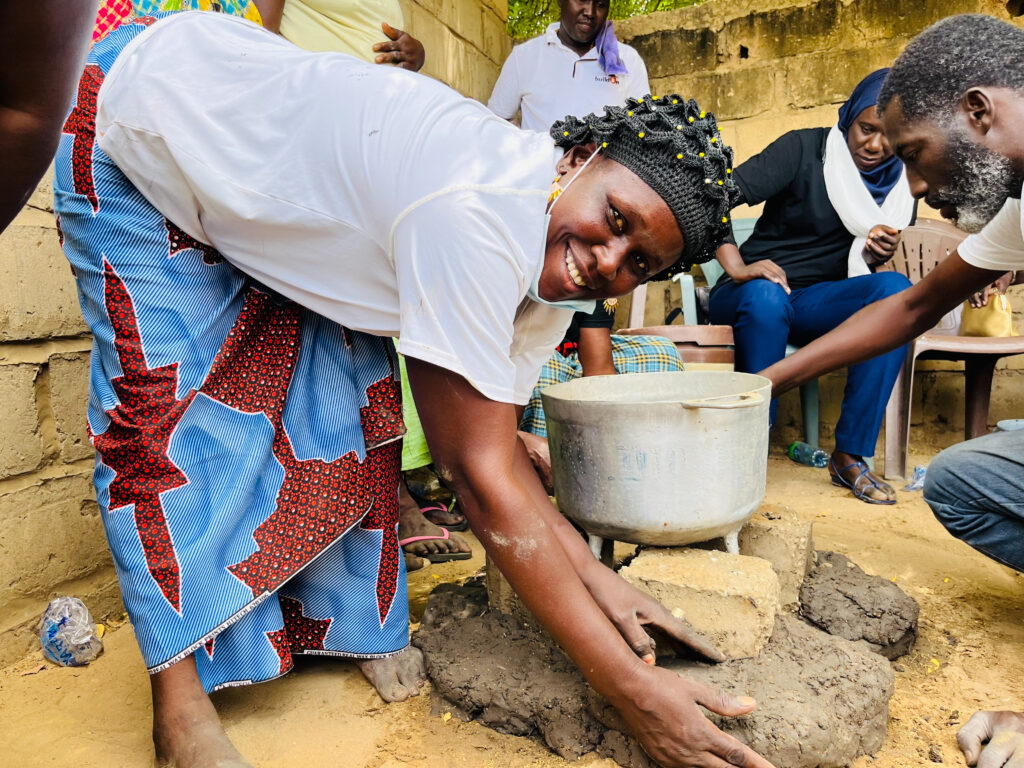 Participants learned how to make the walls of the stove out of clay.
