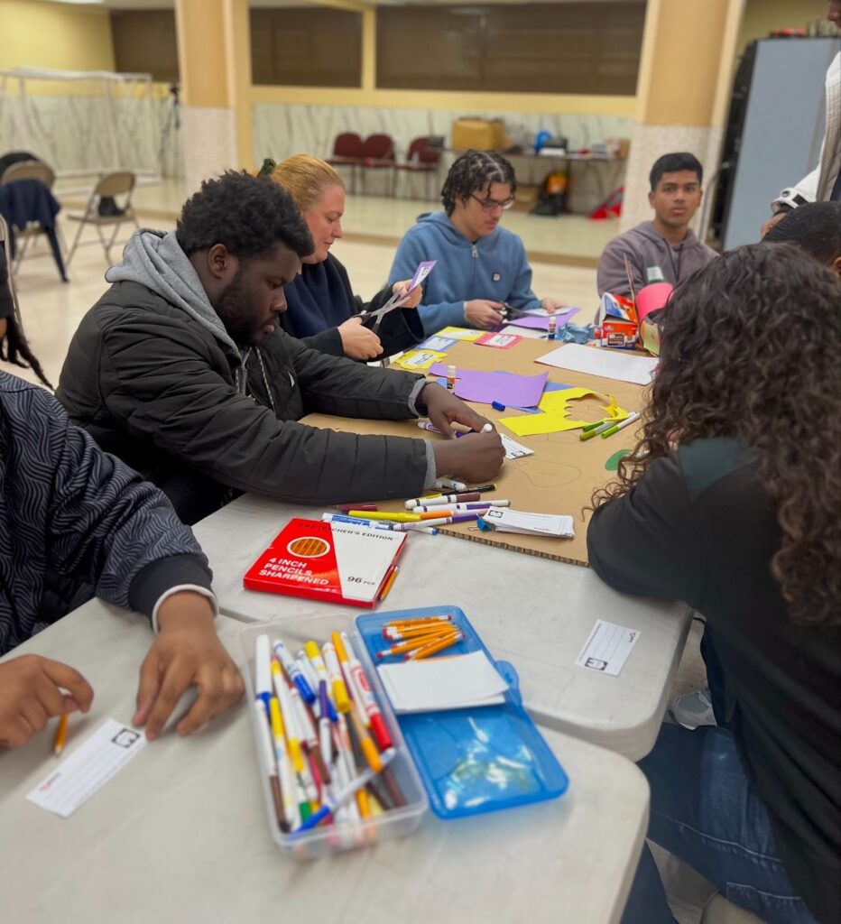 buildOn students in Bridgeport assemble hand warming kits complete with notes of encouragement.
