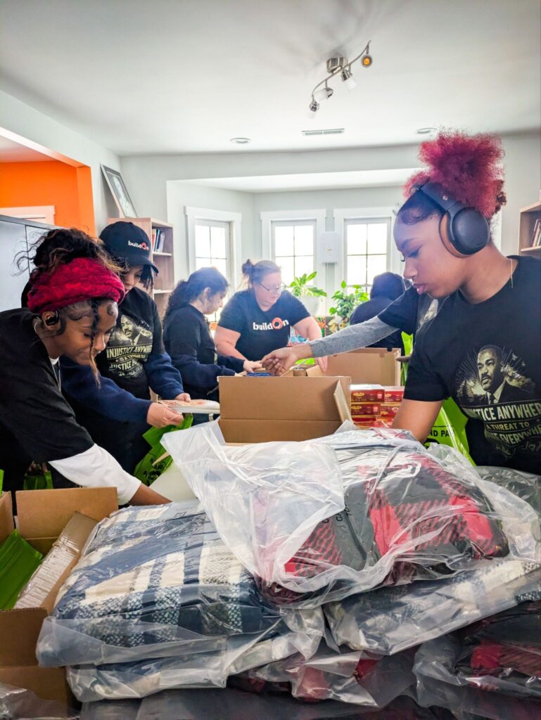 Together, buildOn students packed winter wellness kits for residents of five senior homes.