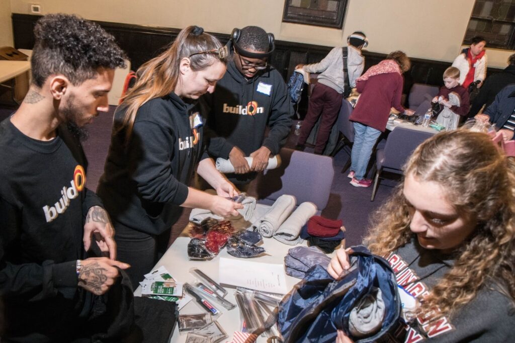 buildOn students in Boston assemble winter care kits.