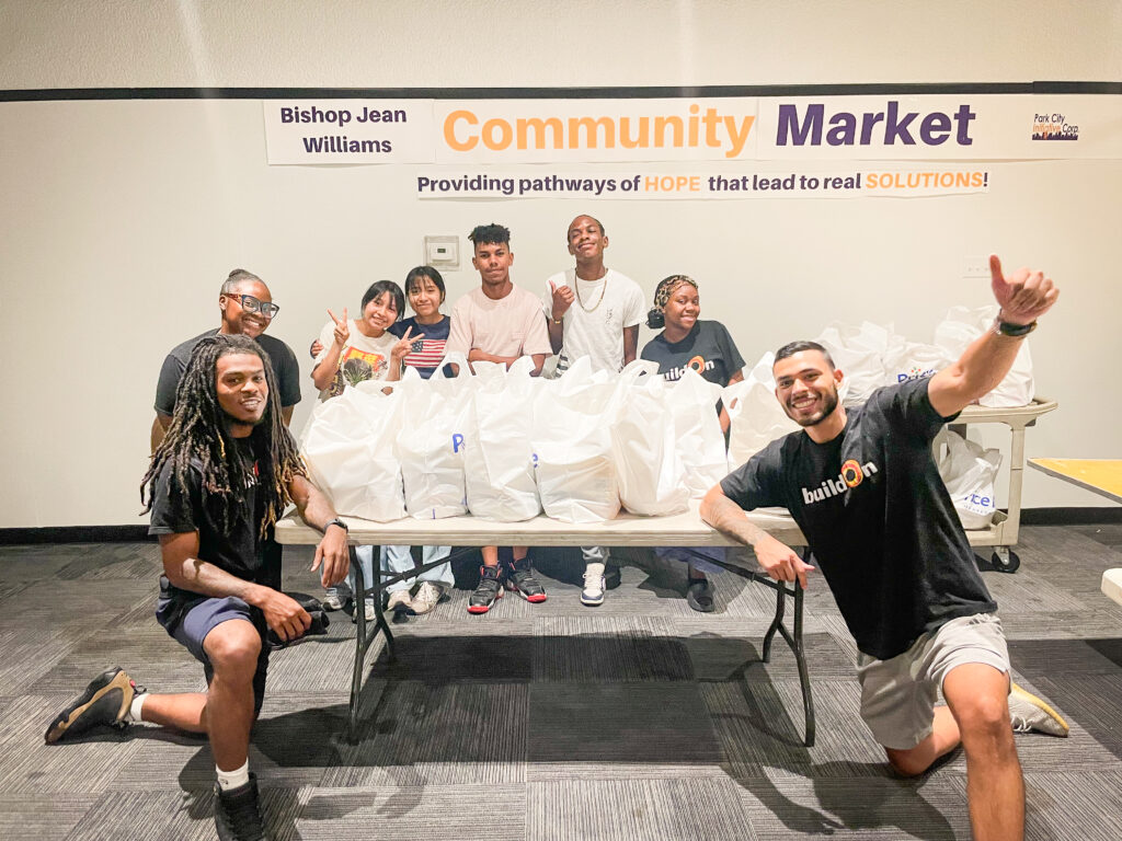 Cedric (left) serves alongside his students at food pantries like this one in Bridgeport.