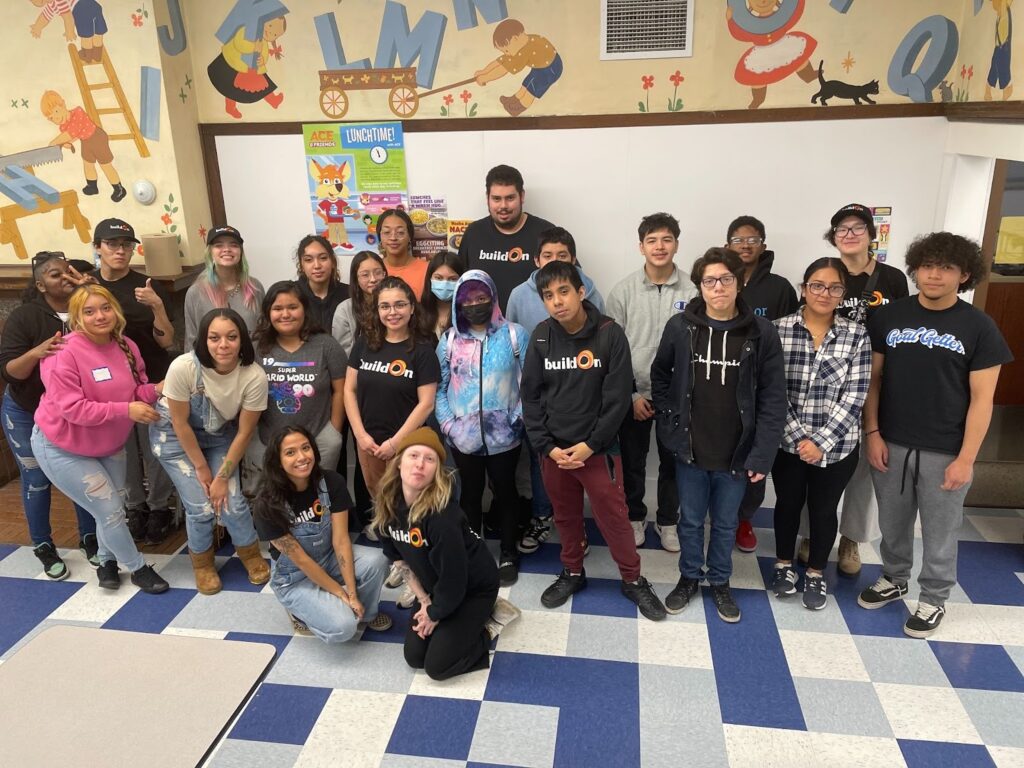 Juan serves as a mentor for younger students, serving alongside them at places like Pasteur Elementary.