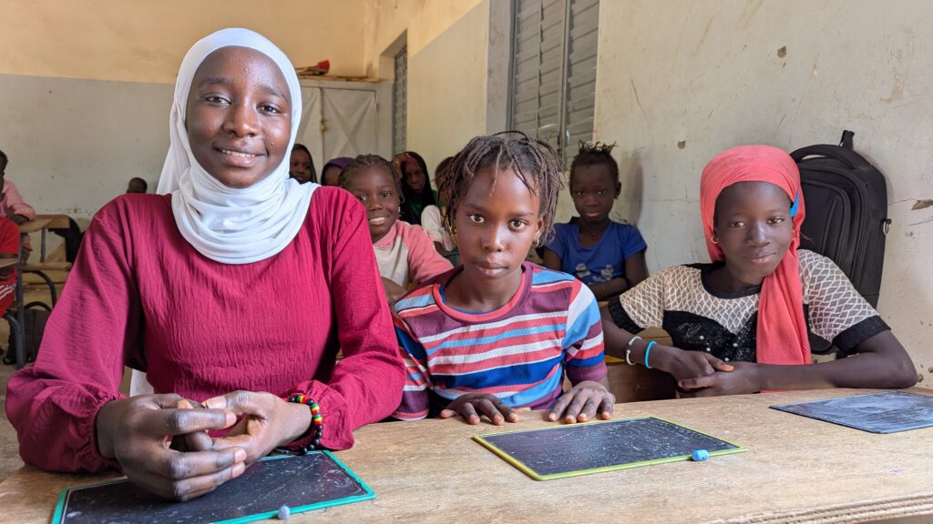 Ndiougue with students in her former classroom at Back Seck School.