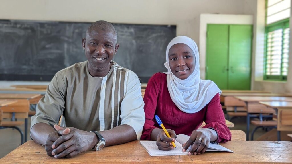 Ndiougue with her former Principal, Mr. Diouf.