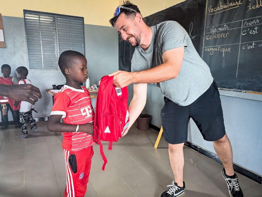 A child receives a new SchoolBag in Senegal.
