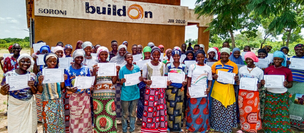 Rokiatou and her classmates proudly display their graduation certificates.