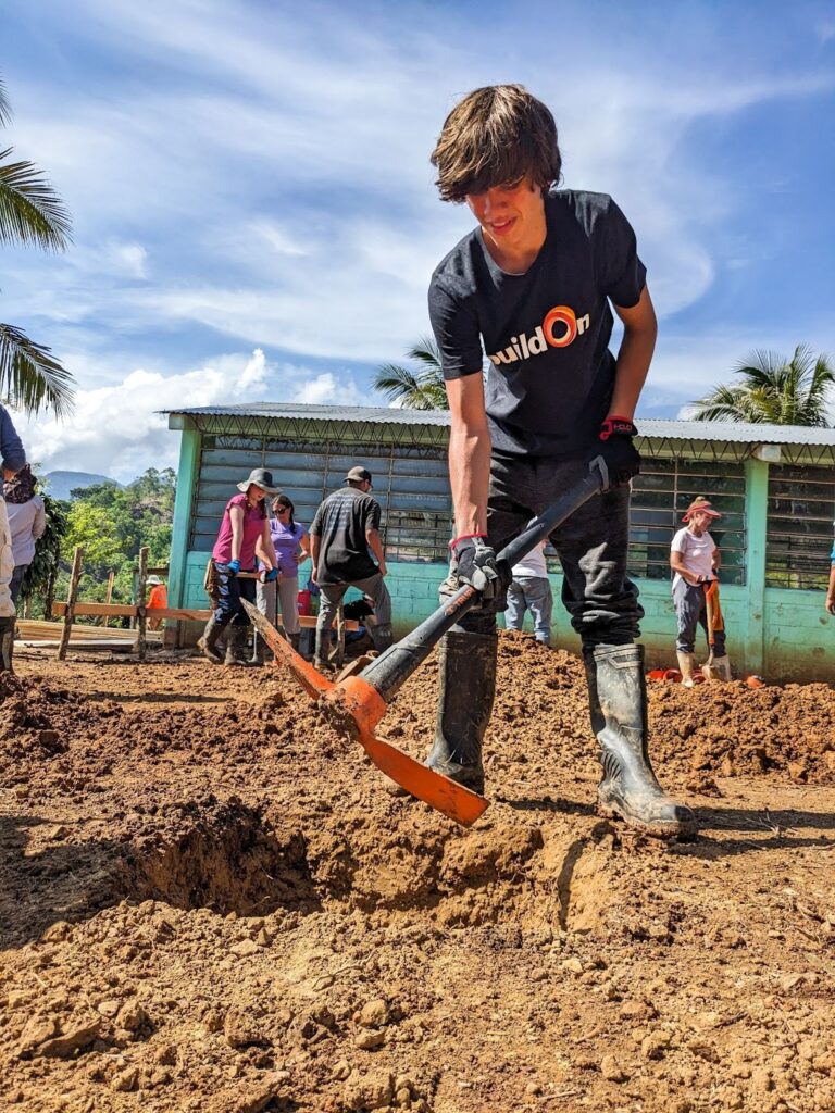 The work on Trek, such as digging the foundation with a pickaxe, can be challenging but rewarding.