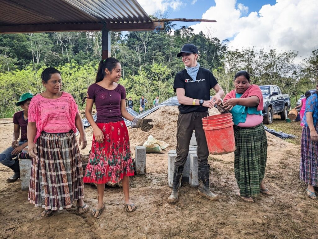Trek participants work alongside local women and men to help build the new school.