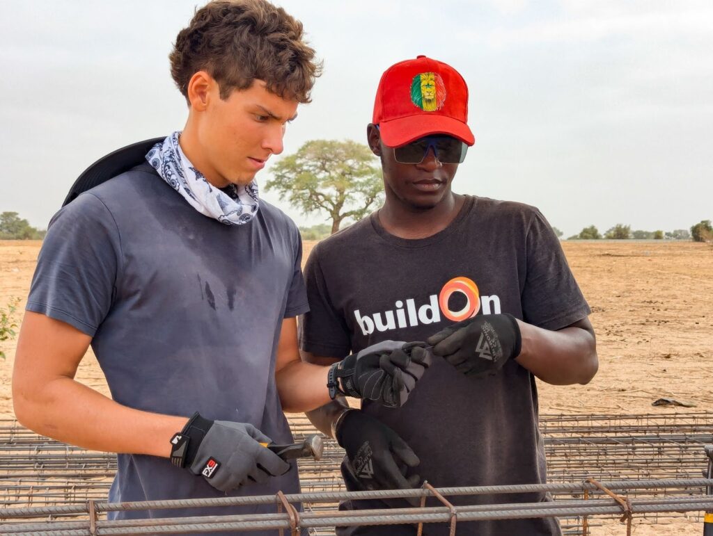 Pine View buildOn Club Co-President Greyson Dawes ties rebar in Senegal.