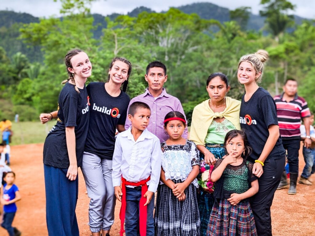 Reese Stroud and Addison Hays with their host family in Guatemala.