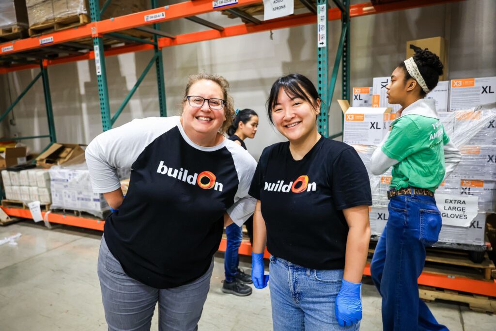buildOn in Detroit Executive Director Rosann Jager serves at a food bank.