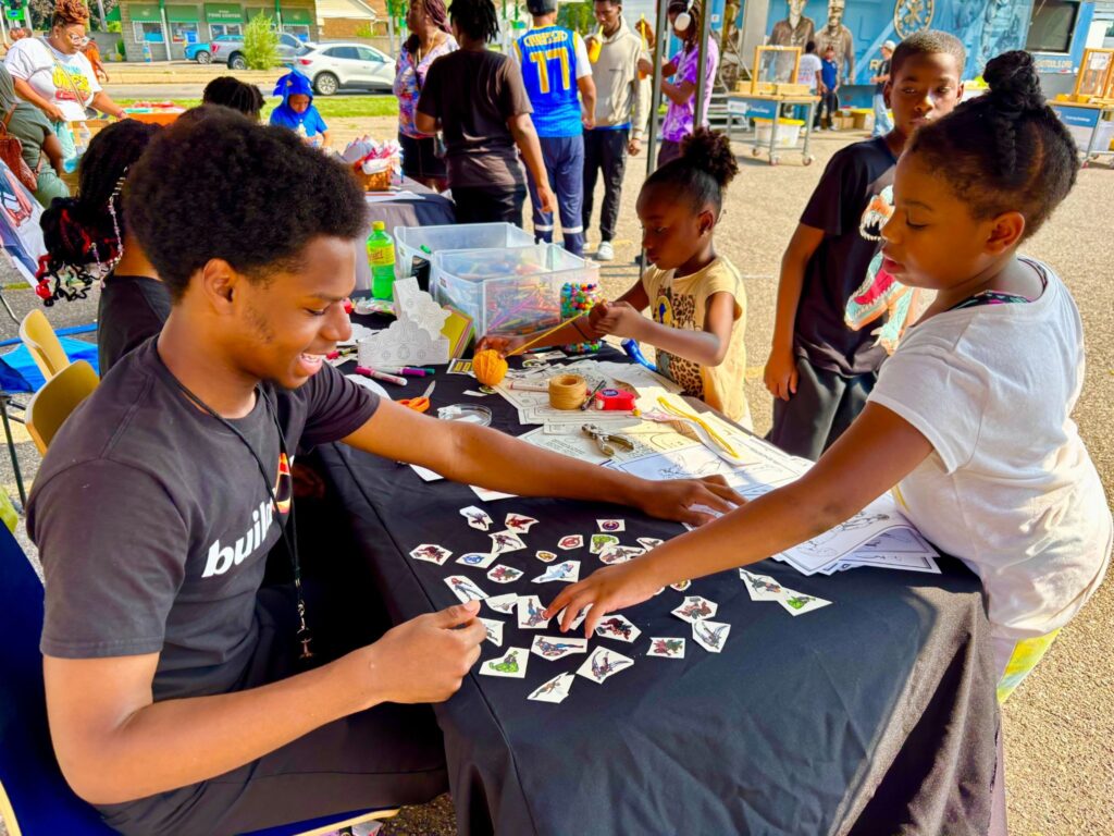 buildOn students in Detroit help out at a backpack and school supply giveaway at Pershing High School.