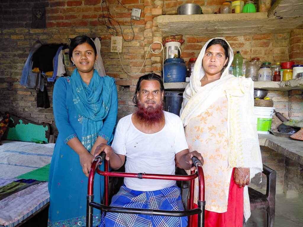 Afrin with her mother and father. Today, their family has a brighter future.