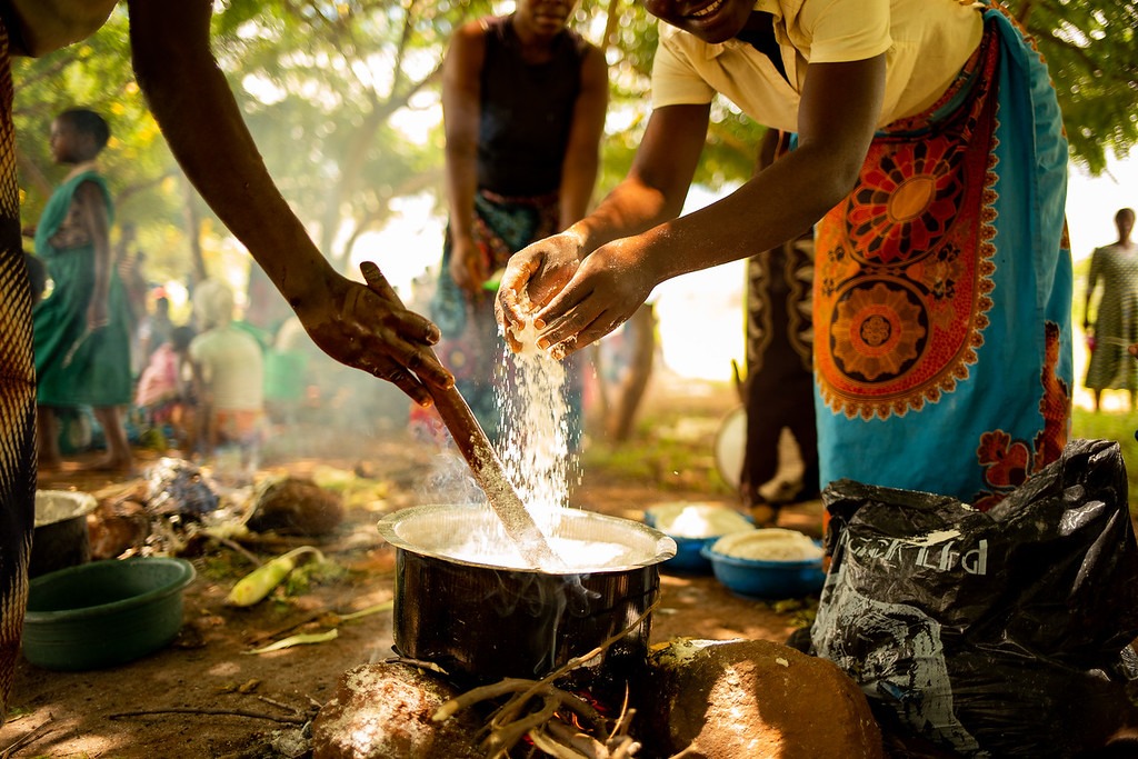 Women making Nsima, Malawi’s signature dish.