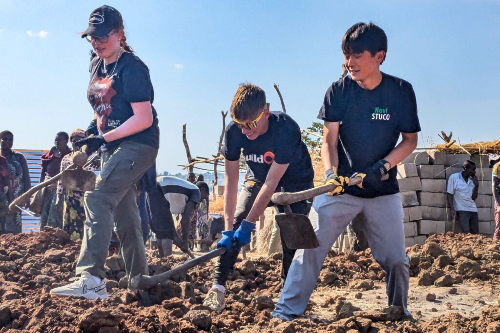 High school students help to dig the foundation of a new buildOn school in Malawi.