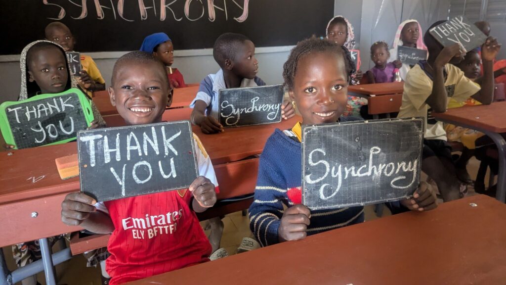 Students in Loukouk beam in their brand new classrooms.