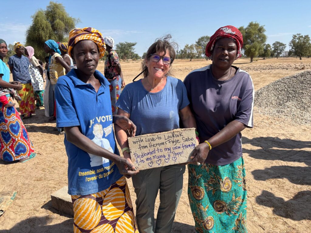 The team wrote messages of support on bricks to be added to the school’s foundation.
