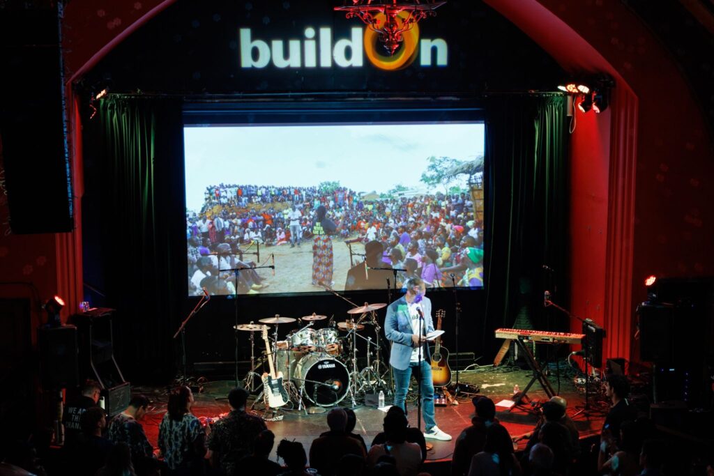 buildOn VP of Development Aled Hollingworth onstage at buildOn’s Better Together concert.
