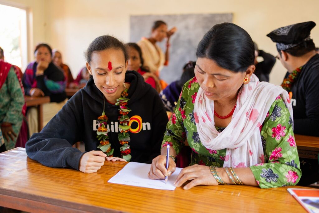 Ashley with an Adult Literacy Program participant in Nepal.