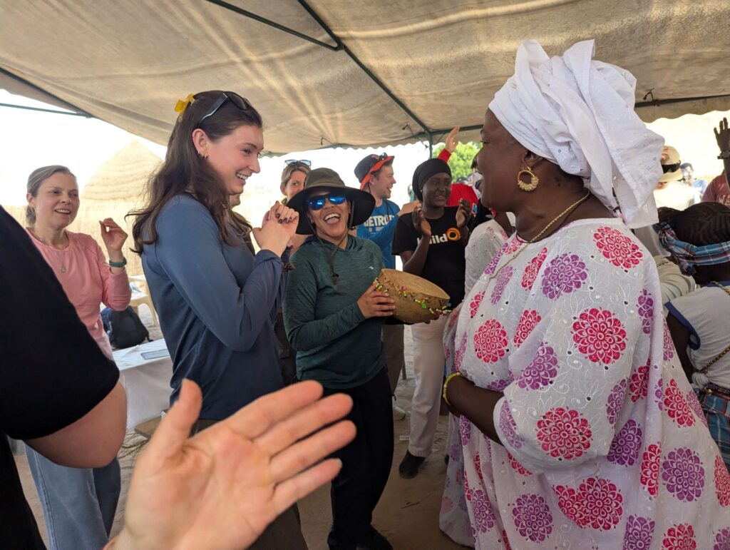 The people of Loukouk welcomed the Synchrony team to their community with a ceremony filled with music and dancing.
