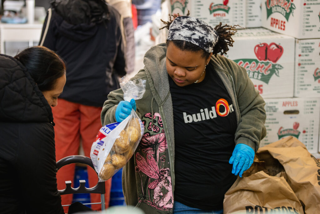 A Bronx student helps out at a local food pantry.