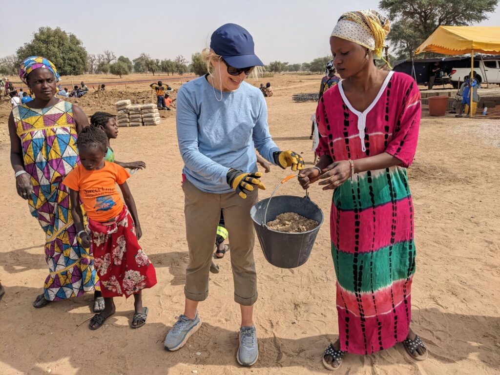 Trek is an opportunity to work side by side with community members in Senegal, such as on an iconic bucket line.