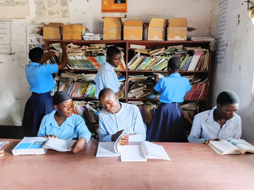 Patrick (center) with his peers in class.