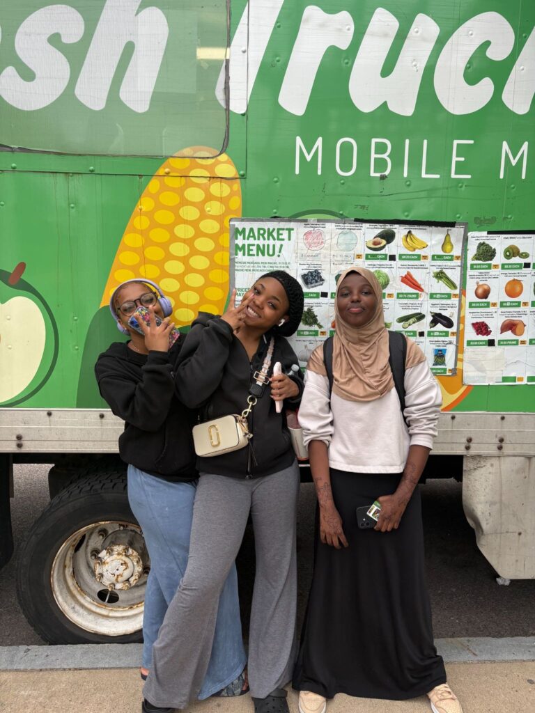 Shawna Sweeting (center) serving at a mobile food pantry in Boston.