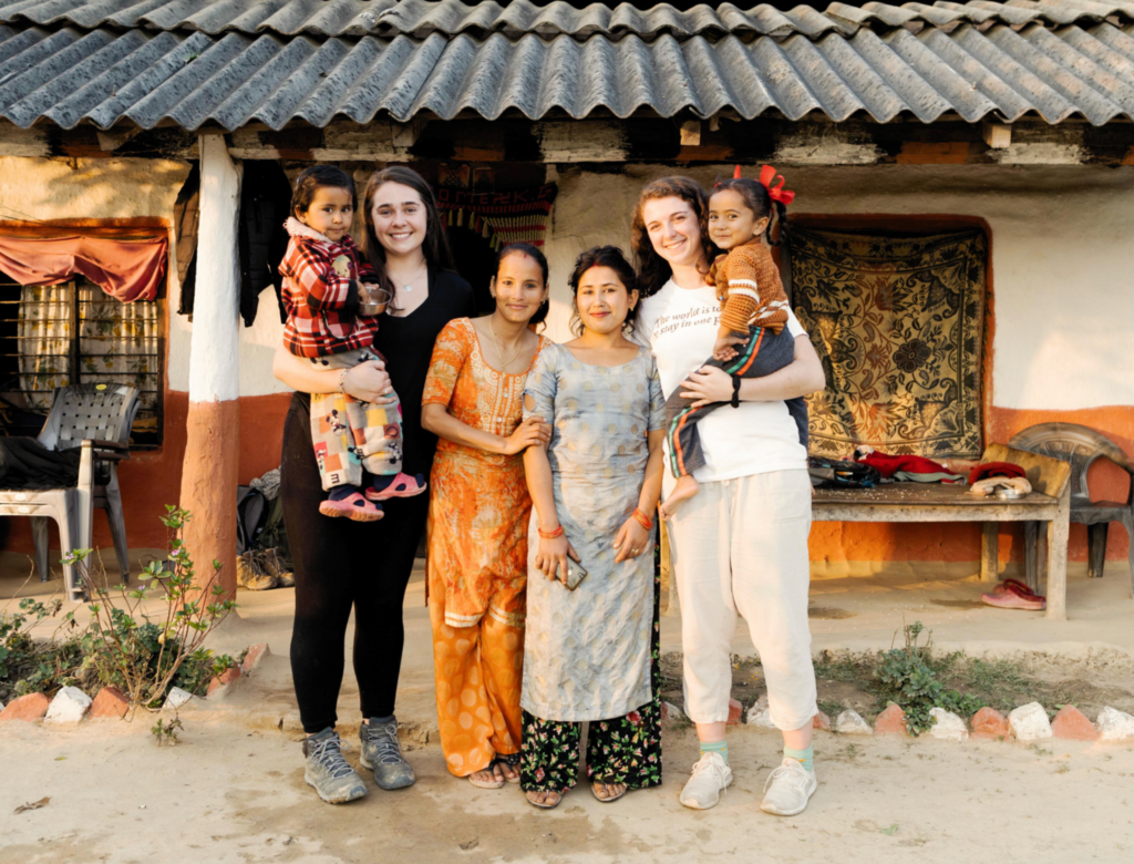 Trek participants with their host family in Nepal.