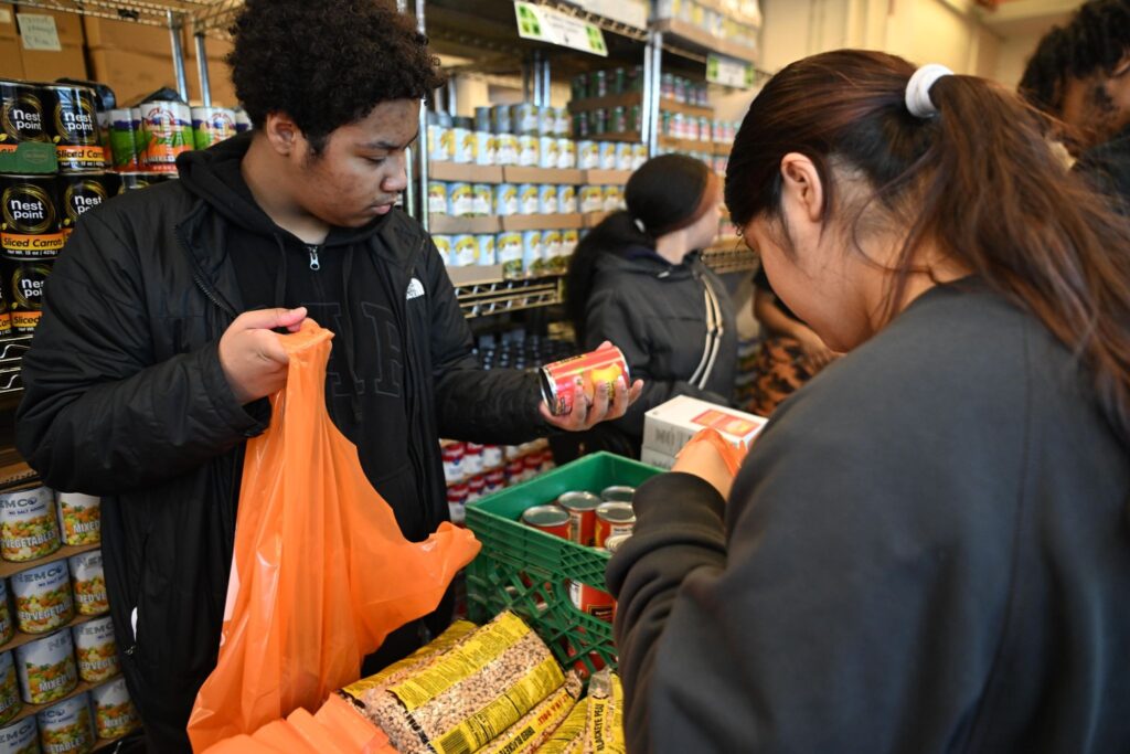 buildOn students in the Bronx help out at Part of the Solution, a local food bank.