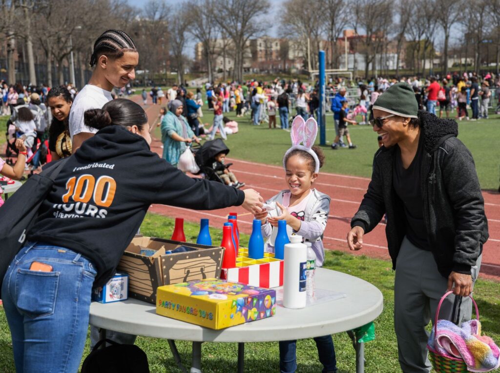 buildOn students in the Bronx help out at a community Easter egg hunt.