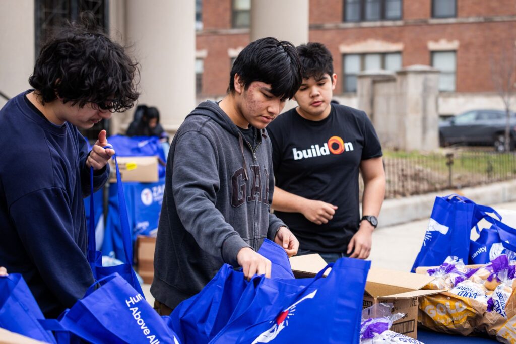 buildOn students distribute food to their neighbors in Chicago with Zakat Foundation.