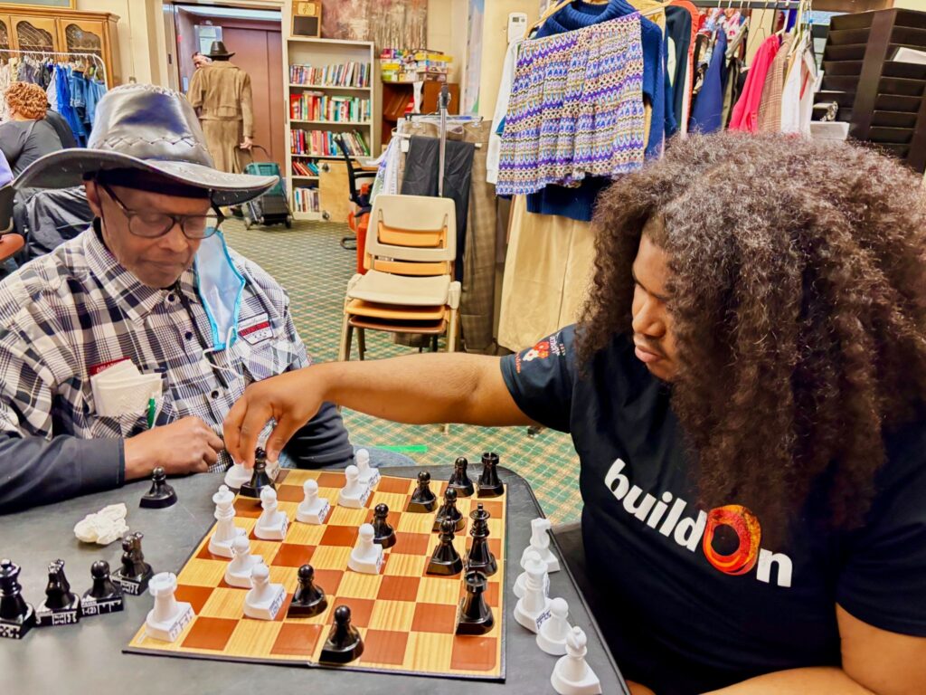 A student spends time with seniors in Detroit.