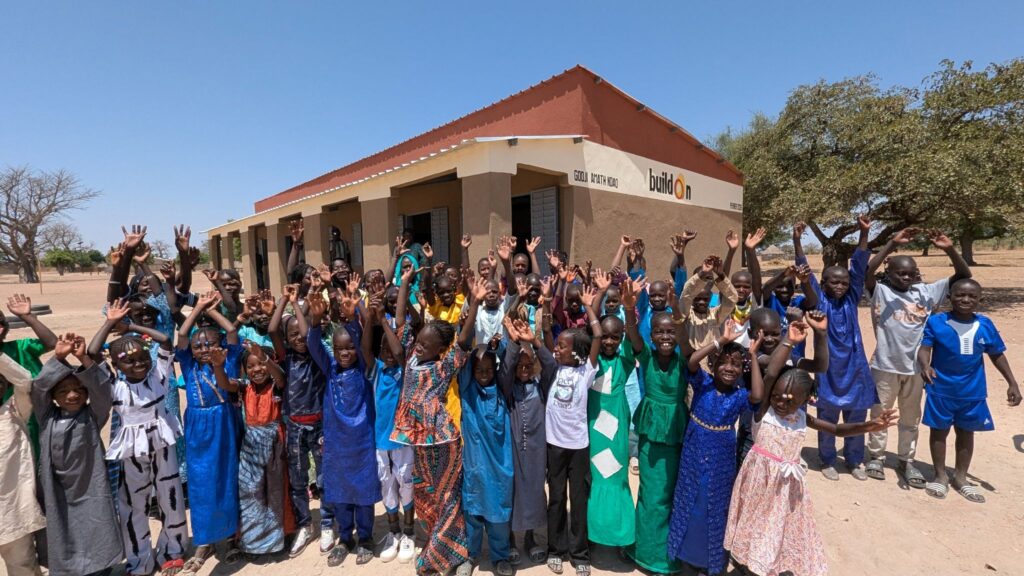 Aissatou with her classmates in front of their new school.