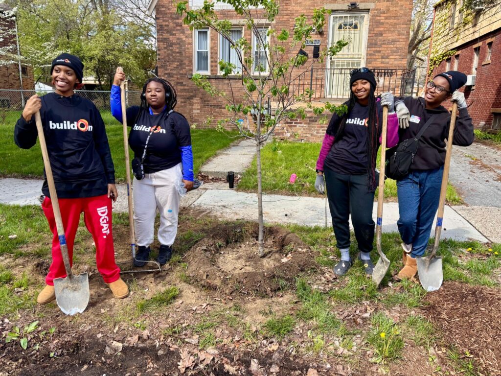 buildOn students in Detroit help plant trees with The Greening of Detroit.
